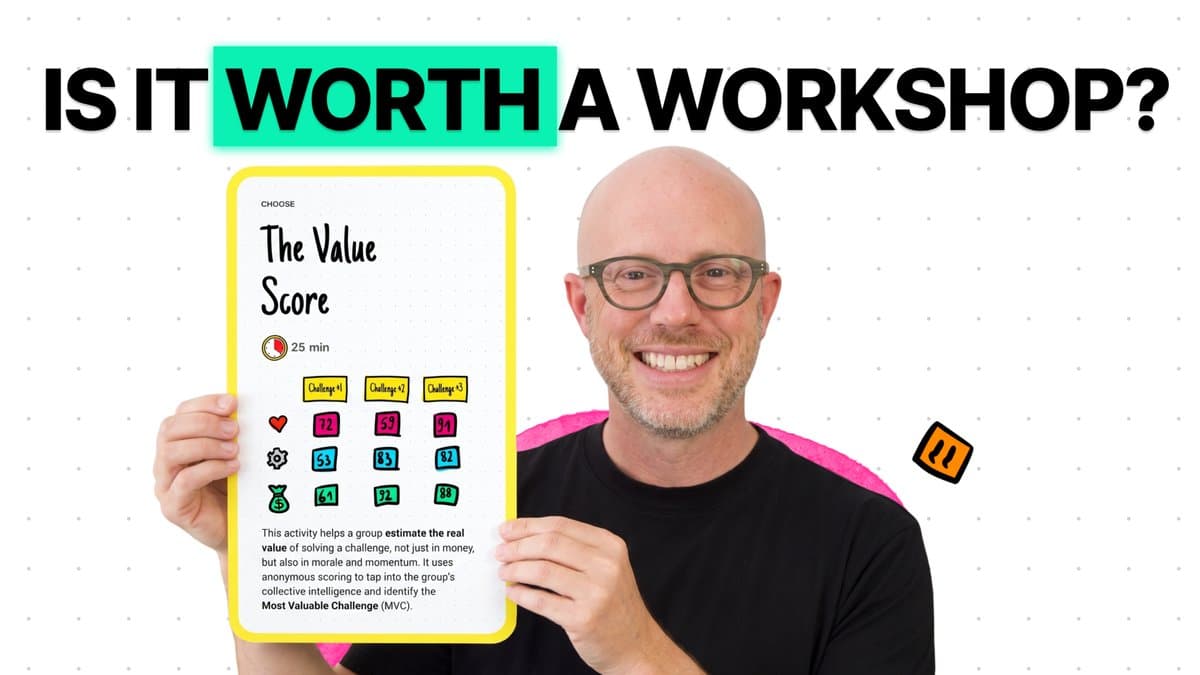 Tim Leake holding the Value Score Workshop Deck card